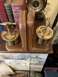 2 Lunkenheimer Marine No. 3 T-handle Automatic Brass Grease Cup Wood Book Ends. Fixed Price $250.00.